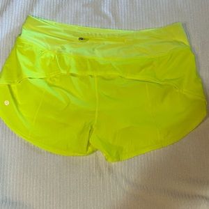 Bright highlighter yellow Lululemon run times shorts